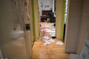 Shocking: The chilling image from the Charlie Hebdo office shows blood-stained wooden floors, papers strewn across the corridor. Photo courtesy: Ents Images/London Daily Mail