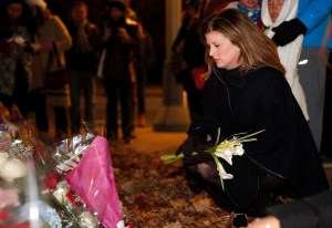 Rona Ambrose visits a memorial in Paris to the terrorist victims from the Friday the 13th attacks.